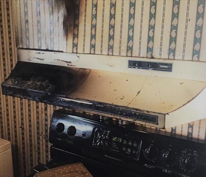 burned oven and range hood in kitchen 