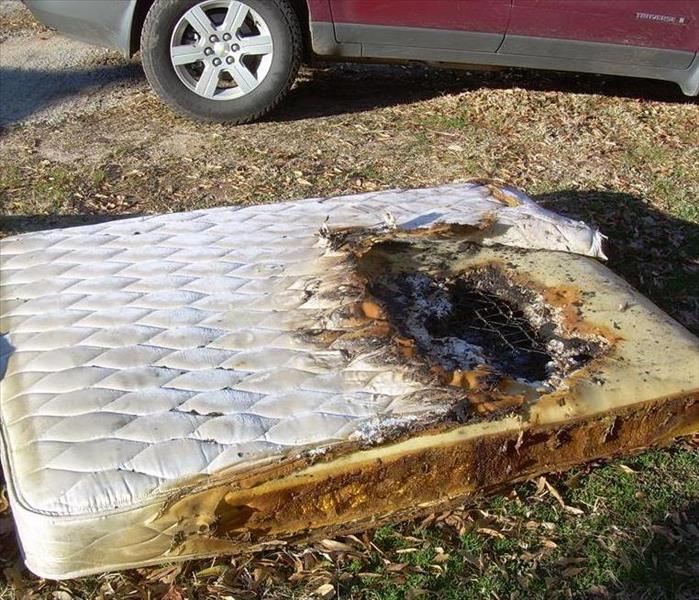 Burned Mattress With Hole In It. 